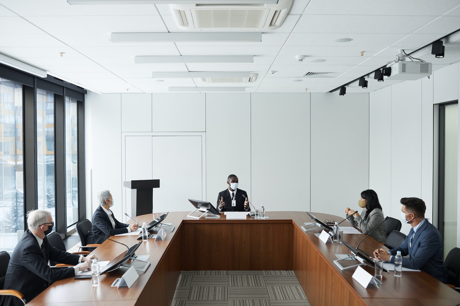 Professional People wearing Face Mask having a Meeting